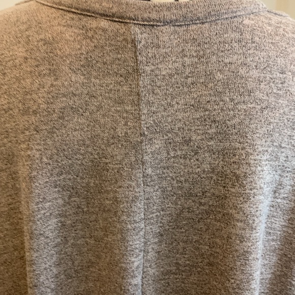 NWOT. Woman’s short sleeve cut out neckline top with twisted front hemline. - Picture 7 of 10